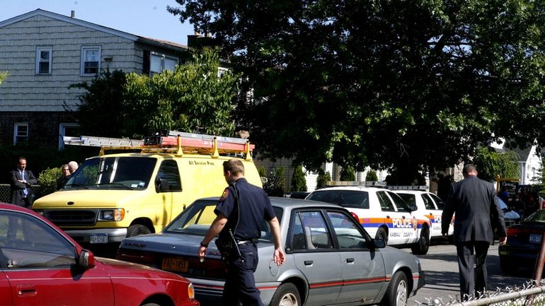 Nassau police investigate the scene on Melrose Street where two...