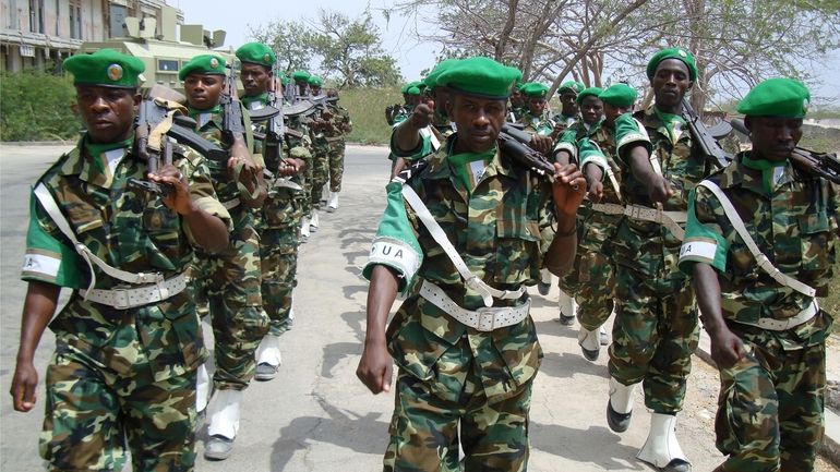 Burundian soldiers, part of the African Union troops, march at...