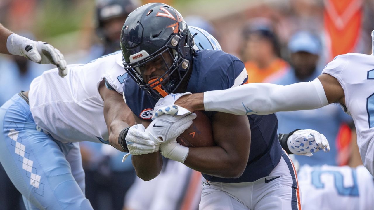 Virginia player wounded in deadly attack returns for a new season as an inspiration to his teammates