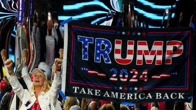 A supporter cheers during the Republican National Convention Thursday, July...