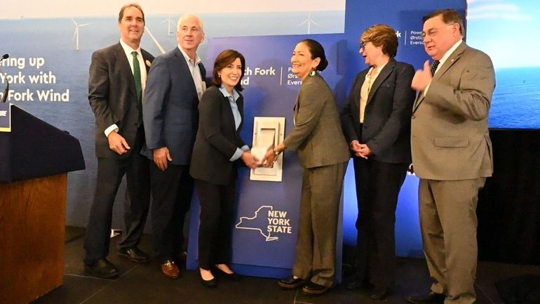 Gov. Hochul and other officials throw a ceremonial switch at...