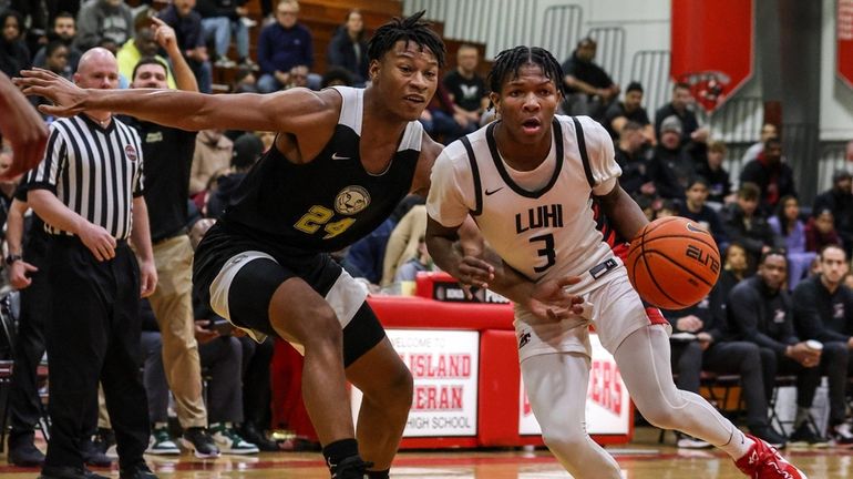 Jayden Reid of Long Island Lutheran drives around Roselle Catholic's...