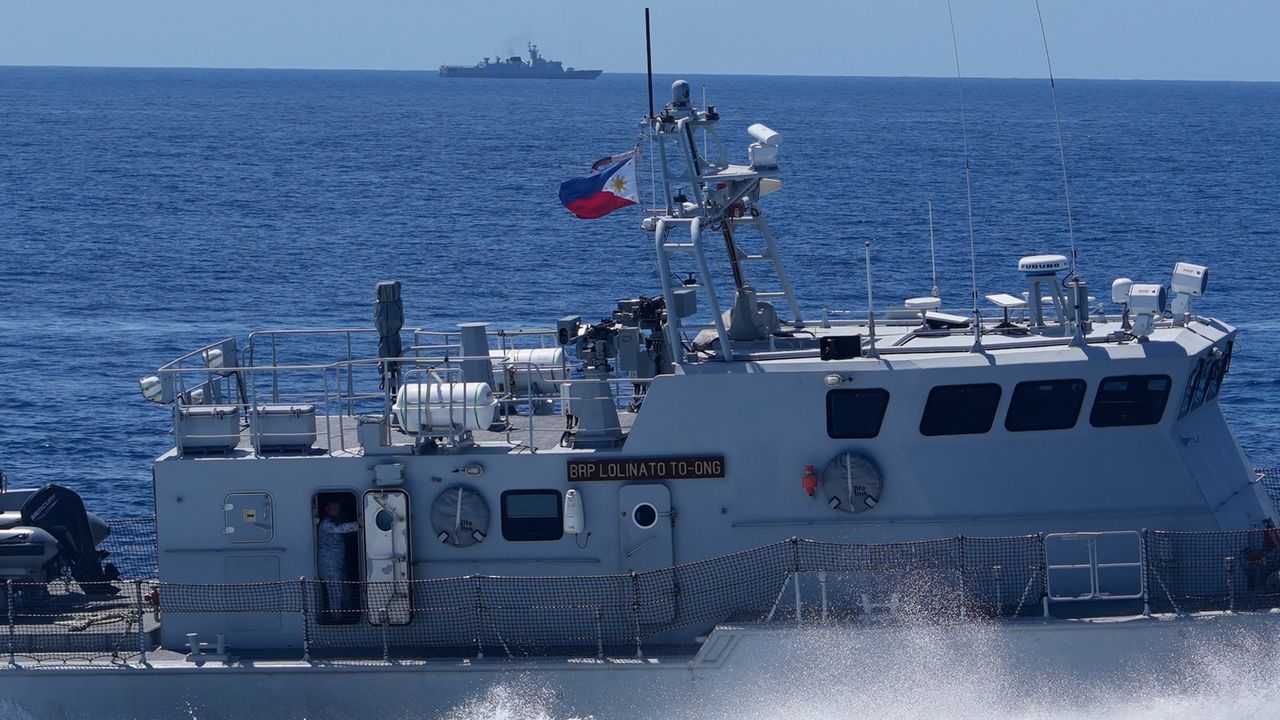 Philippine forces retake an island in mock combat as China’s navy watches