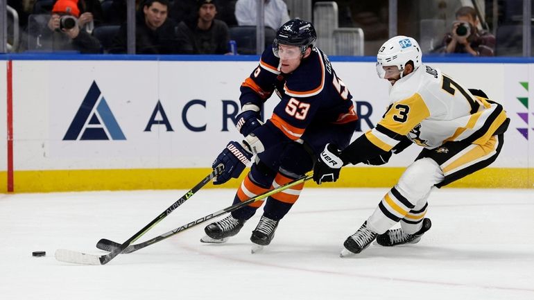 Casey Cizikas #53 of the New York Islanders tries to...