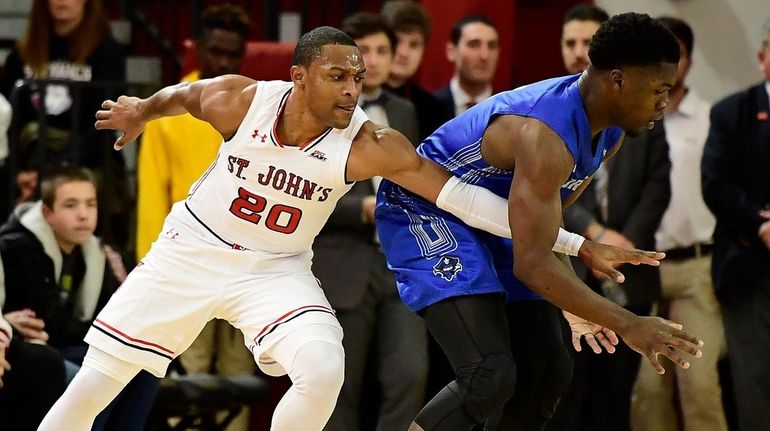 Troy Green of New Orleans is defended by Marcus LoVett...