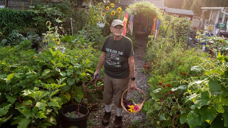 Karl Reamer, 68, in his backyard farm.