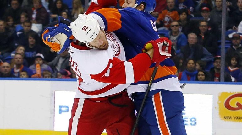 Islanders defenseman Matt Carkner (no. 7) fights during the second...