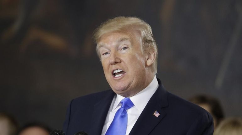 President Donald Trump speaks in the Rotunda of the U.S....