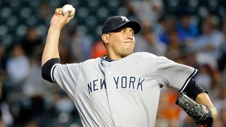 Freddy Garcia of the New York Yankees pitches against the...