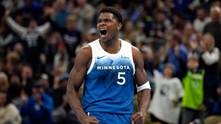 Minnesota Timberwolves guard Anthony Edwards (5) celebrates after making a...