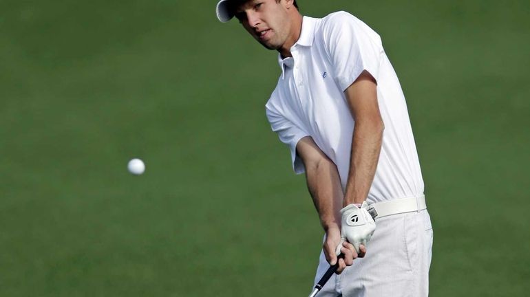 Amateur Steven Fox chips to the second green during a...