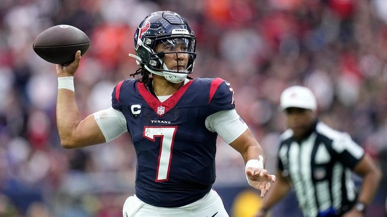 Houston Texans quarterback C.J. Stroud passes against the Denver Broncos...