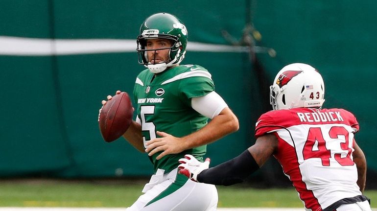 Joe Flacco #5 of the Jets looks to pass during...