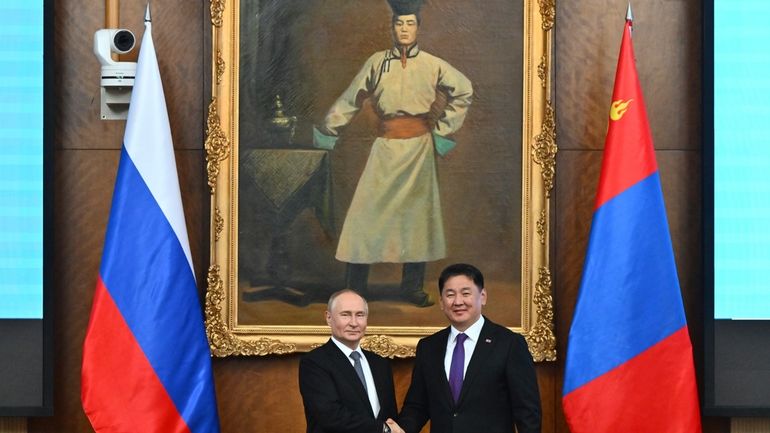 Russian President Vladimir Putin, left and Mongolian President Ukhnaagiin Khurelsukh...