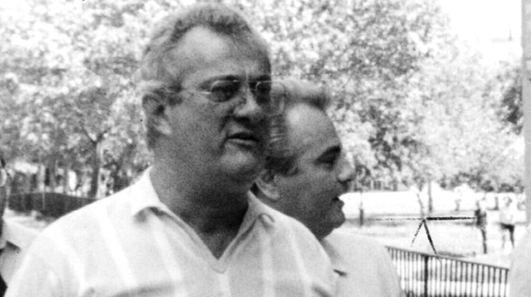 Peter Gotti walks with his brother, John Gotti, in this...