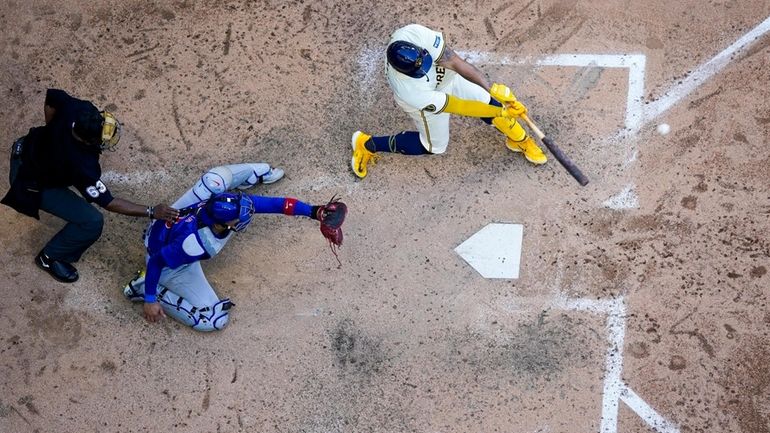 Milwaukee Brewers' Gary Sánchez hits a two-run home run during...