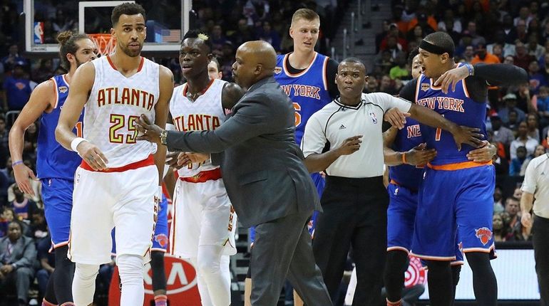 Atlanta Hawks guard Thabo Sefolosha, far left, and Knicks forward...