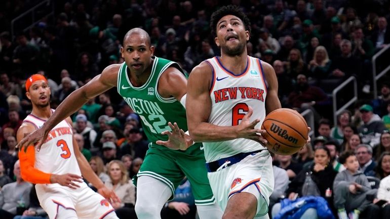 Knicks guard Quentin Grimes (6) drives to the basket past...