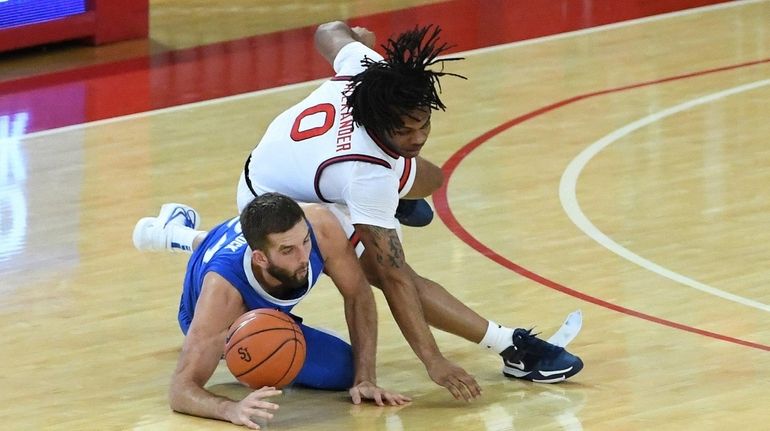 St. John's guard Posh Alexander (13 points) and Creighton's Mitch Ballock...