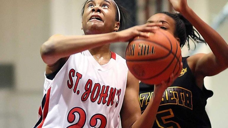 St. John the Baptist's Anastasia Williams moves toward basket during...