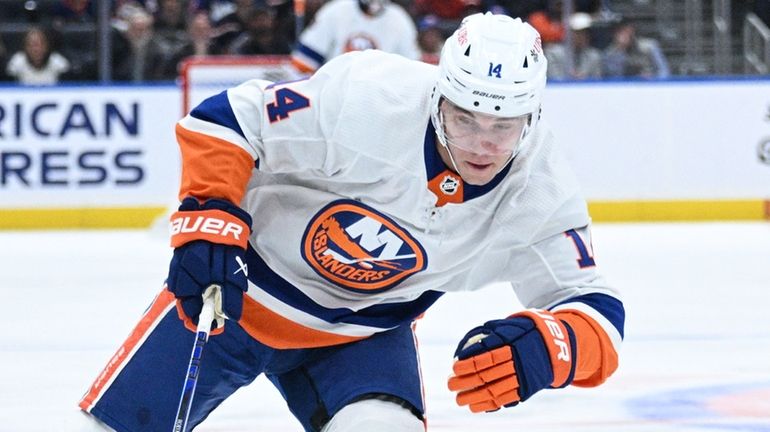 Islanders center Bo Horvat skates with the puck against the...