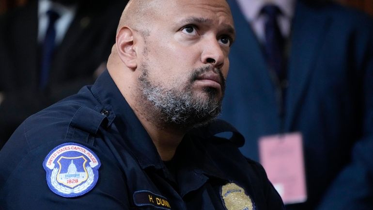 U.S. Capitol Police Sgt. Harry Dunn listens as the House...