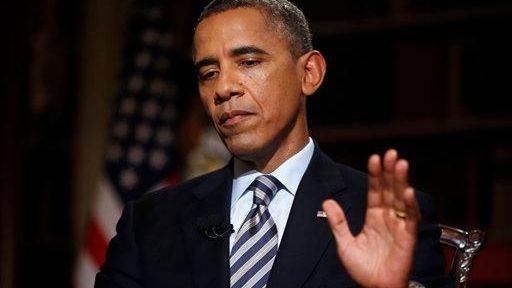 President Barack Obama speaks during an interview in the White...