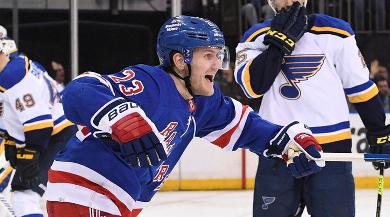 Rangers defenseman Adam Fox reacts after defenseman Patrik Nemeth scored...