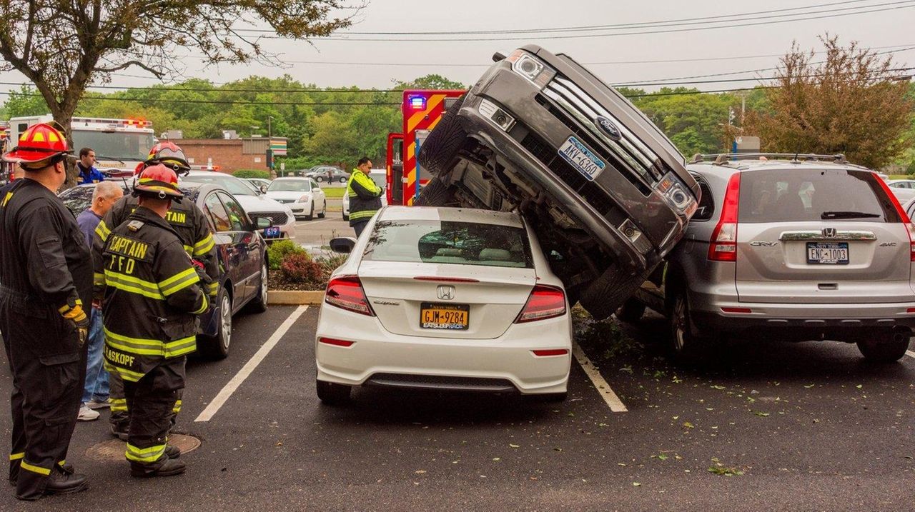 SUV lands on top of car in Farmingville lot, police say Newsday