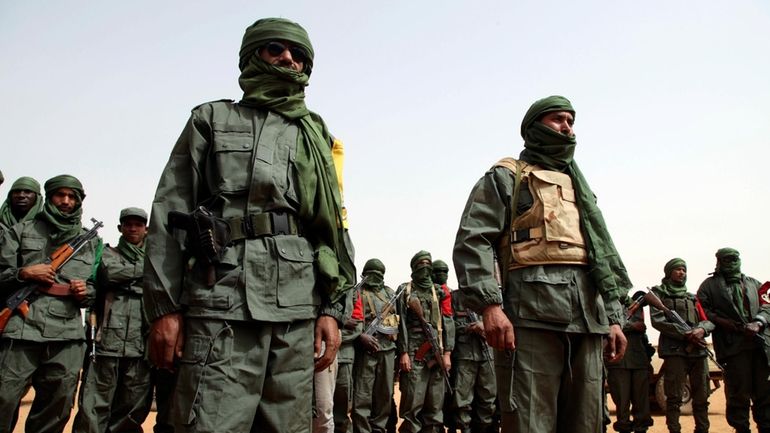 Malian troops join with former members of the Tuareg rebellion...