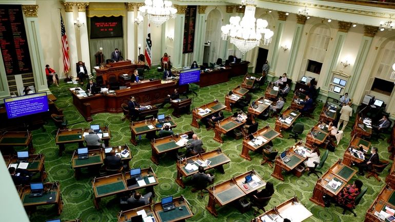 Members of the state Assembly meet at the Capitol May...