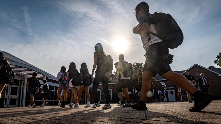 Students arrive for the first day of classes at Jericho High School...