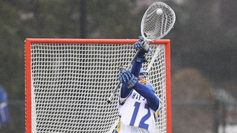 Hofstra's Jack Concannon (12) makes a save in the third...