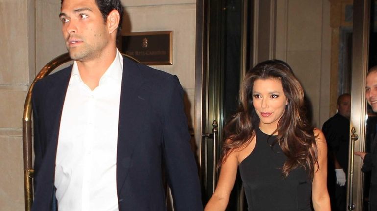 Eva Longoria and Mark Sanchez arrive at the Ritz-Carlton for...
