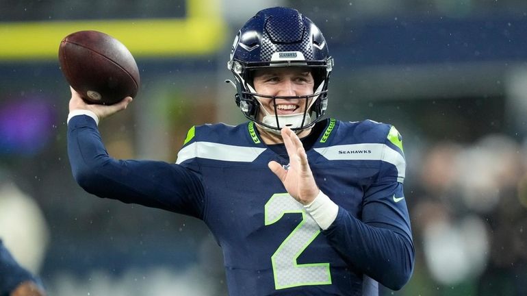 Seahawks quarterback Drew Lock passes the ball before an NFL...