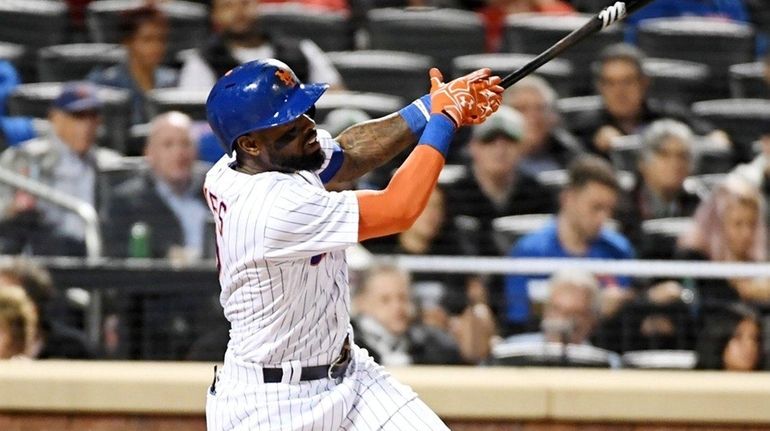 Jose Reyes hits a home run in the third inning,...