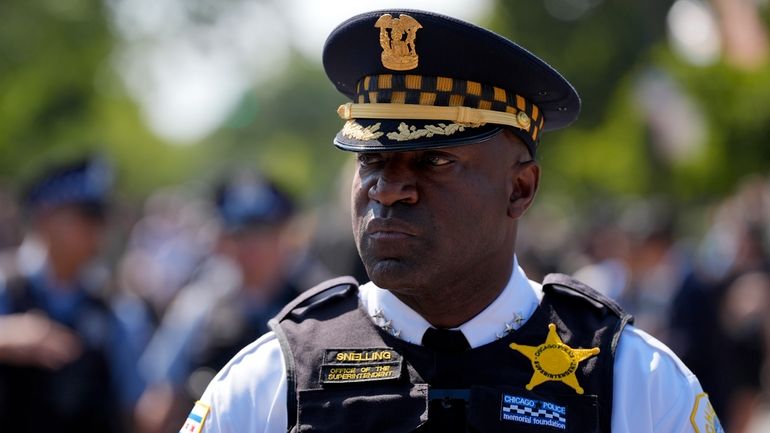 Chicago Police Superintendent Larry Snelling watches a march to the...