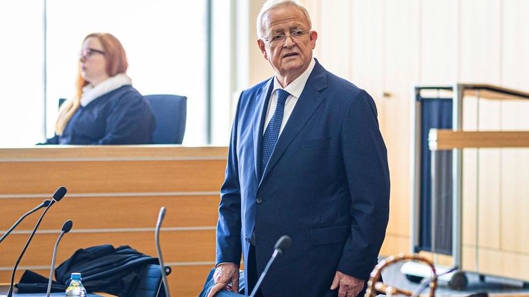 Former Volkswagen Group CEO Martin Winterkorn stands in a hall...