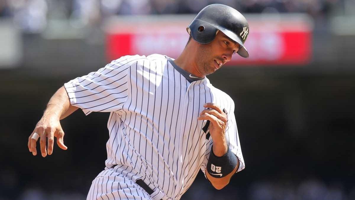 New York Yankees' Jorge Posada (20) hits a two run home run to
