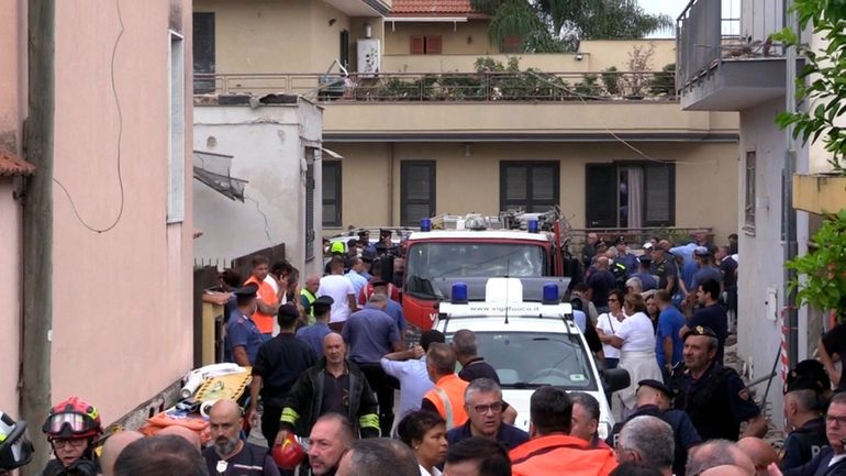 Emergency services attend the site of a building collapse in...