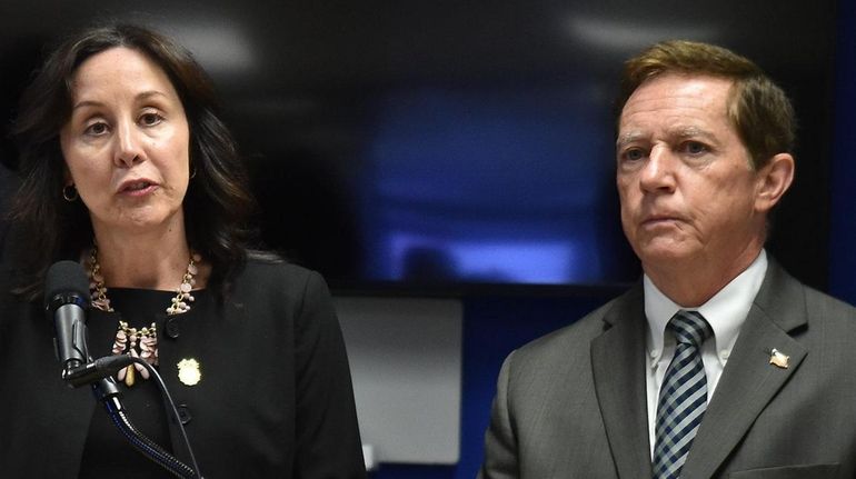 Suffolk County Police Commissioner Geraldine Hart with James Skopek, right, at...