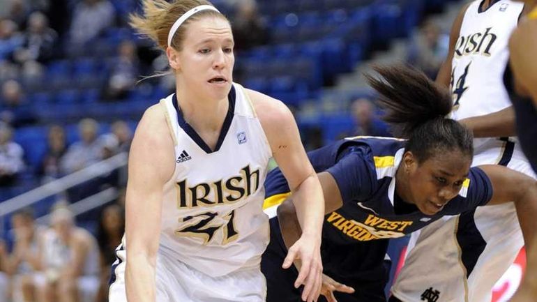 Notre Dame's Natalie Novosel, left, drives past West Virginia's Linda...