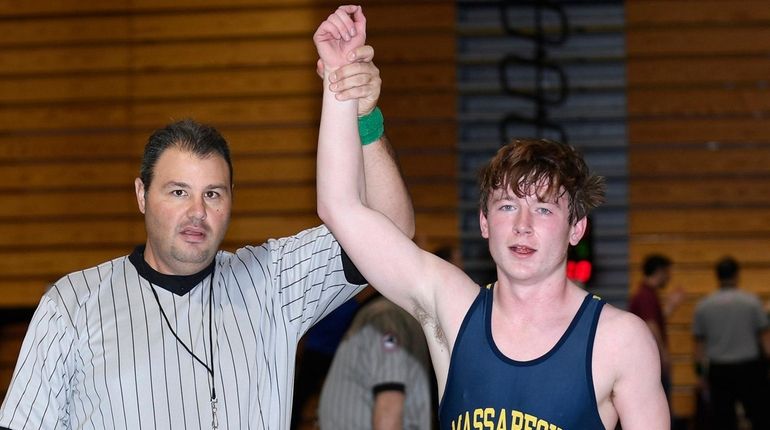 Massapequa's Garrett Gibbons wins his bout against Sewanhaka East's C.J....