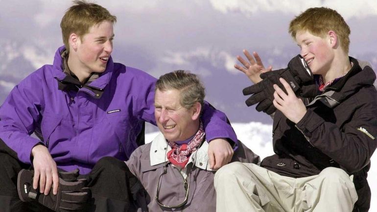 The prince of Wales and his sons, Prince William, left,...