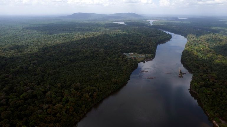 The Essequibo River flows through Kurupukari crossing in Guyana, Saturday,...