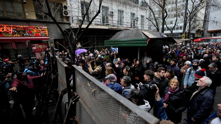 Demonstrators protest outside the Buenos Aires City Legislature against an...