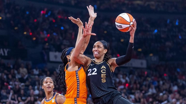 Las Vegas Aces forward A'ja Wilson (22) posts up for...