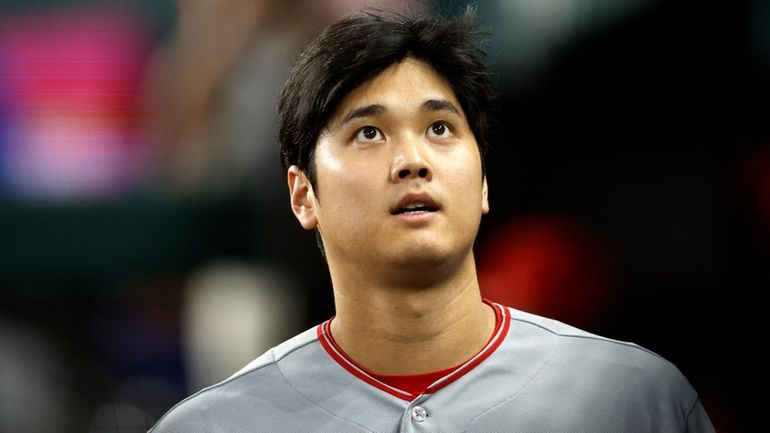 Shohei Ohtani #17 of the Los Angeles Angels looks on...