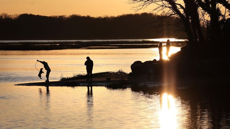 People and pets ventured out onto the rocks and sandbars...