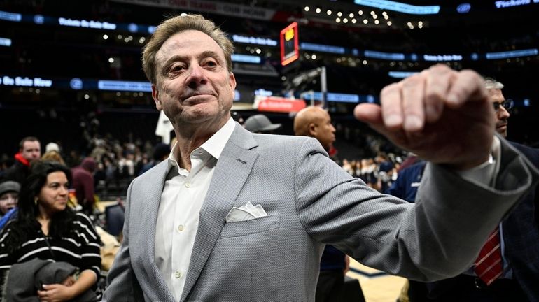 St. John's head coach Rick Pitino leaves the court after...